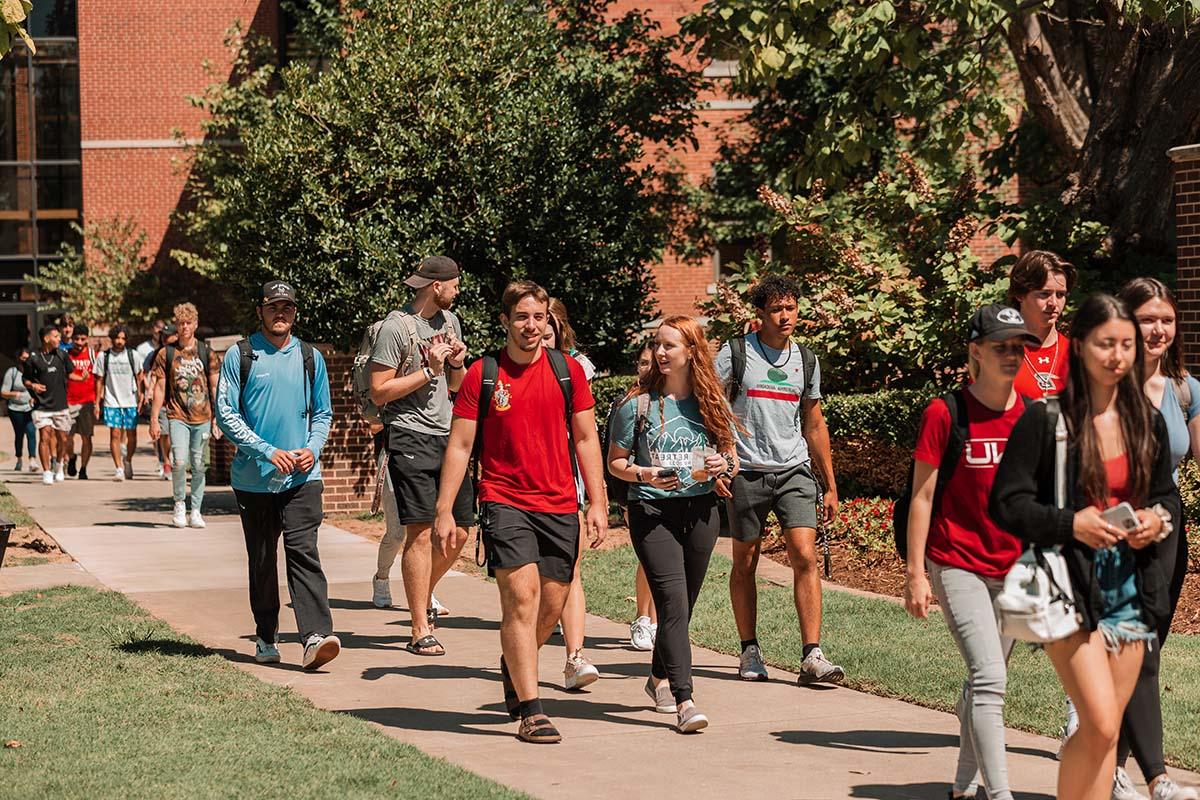 students walking across campus